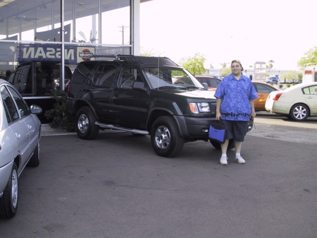 I just signed the paperwork on my Xterra up in Mesa.
This is me.  My laptop bag matches my Hawaiian shirt.  How rad am I?