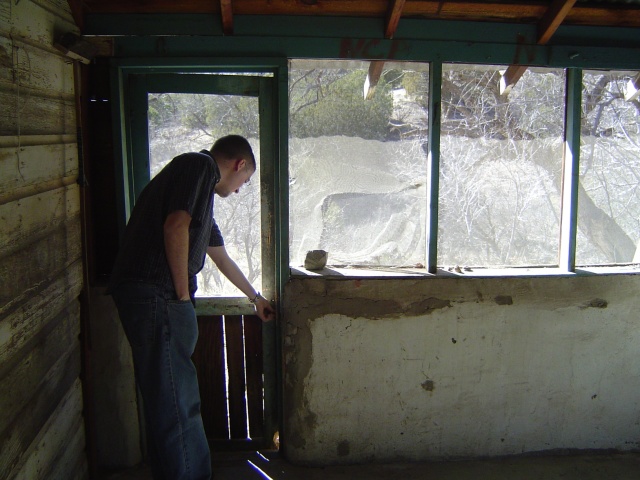 Jack examines the decrepit door.