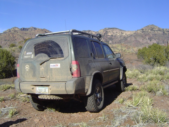 The X, sitting.
