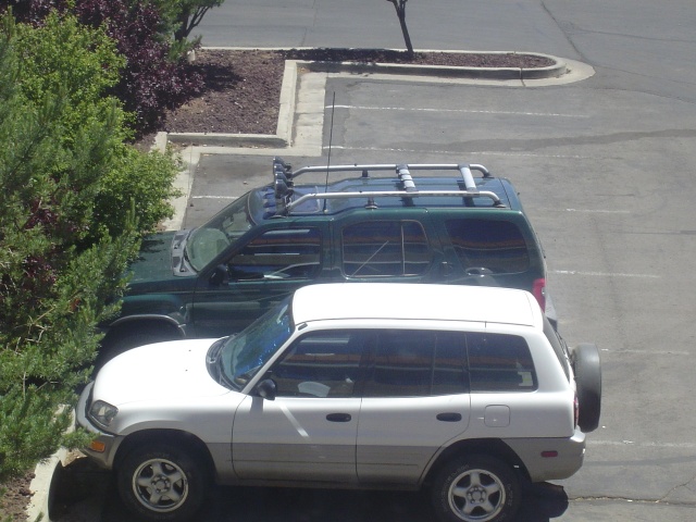 My Xterra clowning a soccer-mom SUV at the Fabulous Radisson Woodlands.