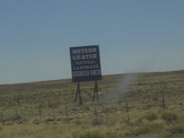 A sign advertising the crater.