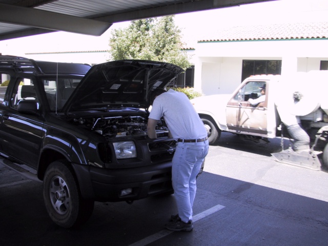 Matt poking in the engine compartment.