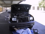 Matt unbolting the stock bumper.  Grill is already off.
We broke plastic tabs and had to buy new ones.  Gus got them for me.