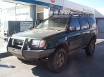 The Xterra, slightly muddy, filling up in Willcox.